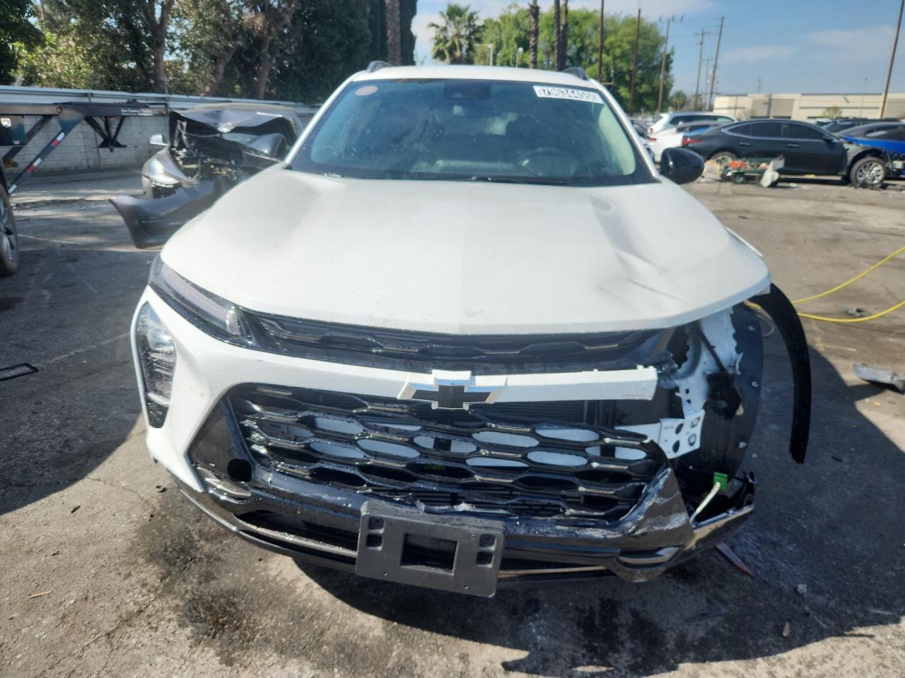 2025 Chevrolet Trax Activ White vin: KL77LKEP1SC121433 Damage: Front Bumper Molding, Broken, Replacement Required
