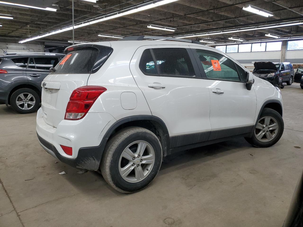 2021 Chevrolet Trax 1lt White vin: KL7CJLSB6MB327925 Damage: Rear Bumper, Heavy Scratch, 7 To 8 Inches