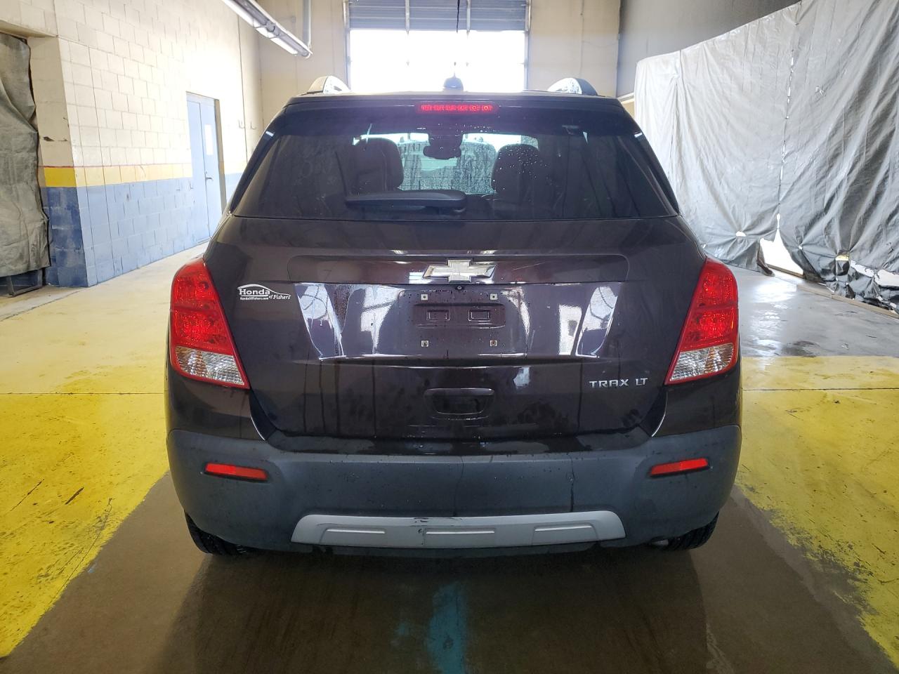 2015 Chevrolet Trax 1lt Brown vin: KL7CJLSB7FB221311 Damage: Rear Bumper Center Molding, Heavy Scratch, 2 To 3 Inches