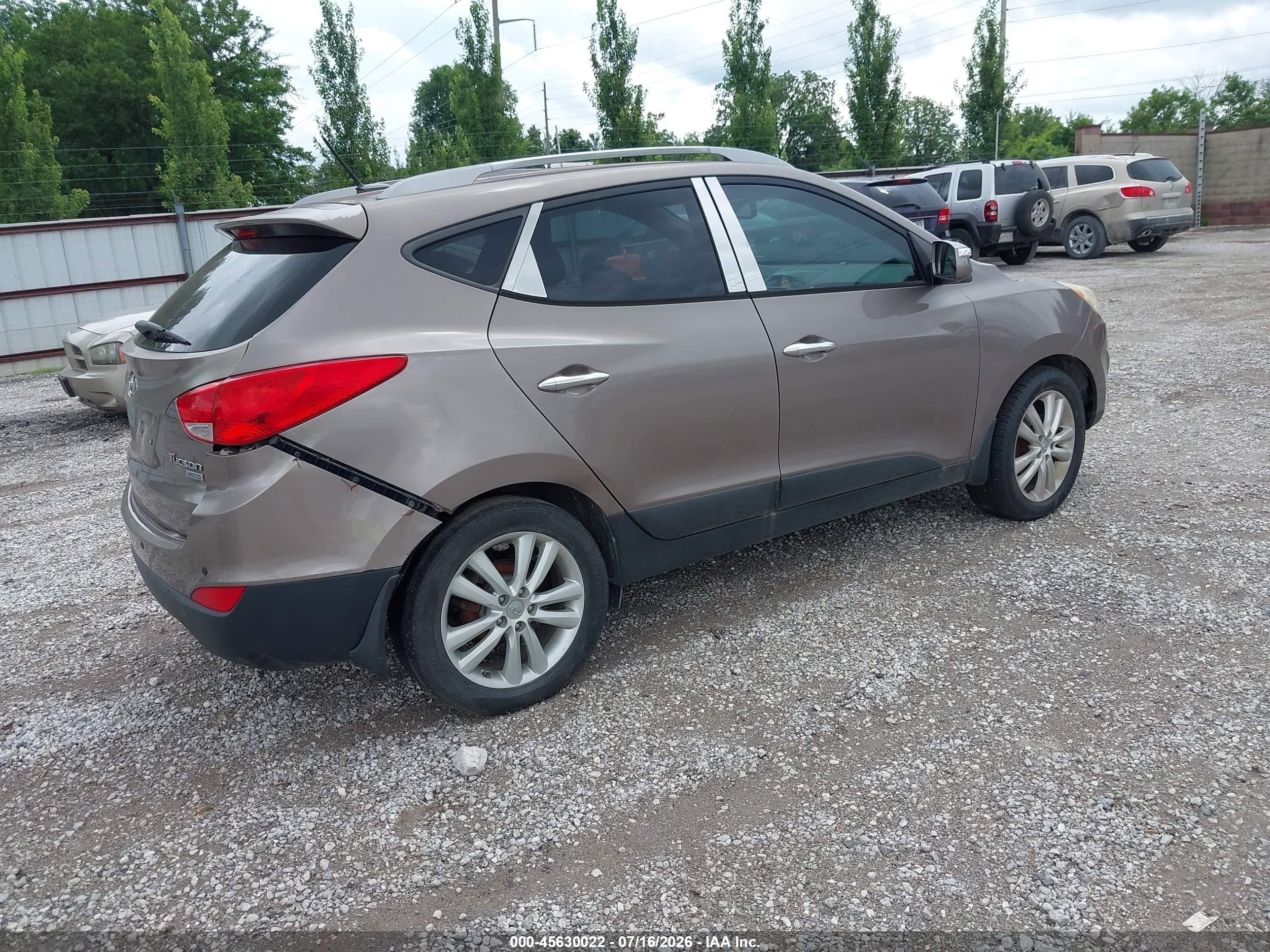 2011 Hyundai Tucson Limited Золотой vin: KM8JU3AC4BU221742