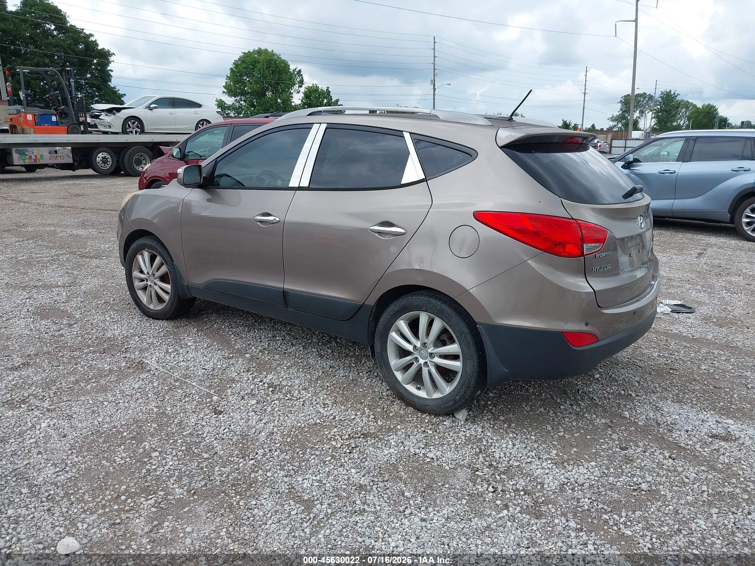 2011 Hyundai Tucson Limited Золотой vin: KM8JU3AC4BU221742