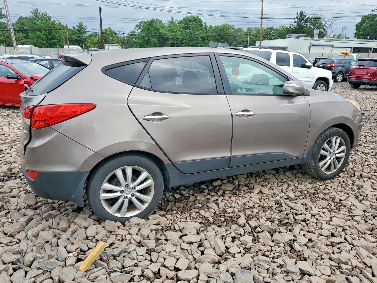 2012 Hyundai Tucson Limited Tan vin: KM8JU3AC5CU523686