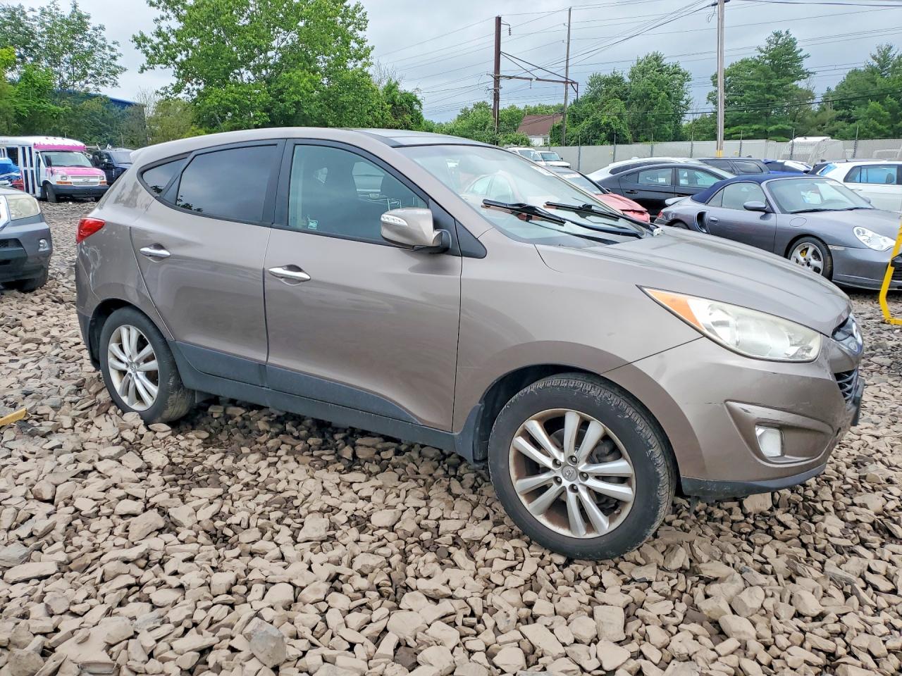 2012 Hyundai Tucson Limited Tan vin: KM8JU3AC5CU523686