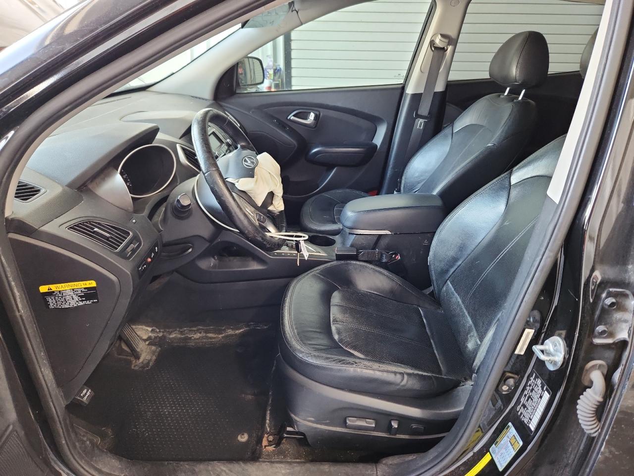 2012 Hyundai Tucson Limited Black vin: KM8JU3AC9CU512898 Damage: Airbag - Front Left, Deployed, Replacement Required