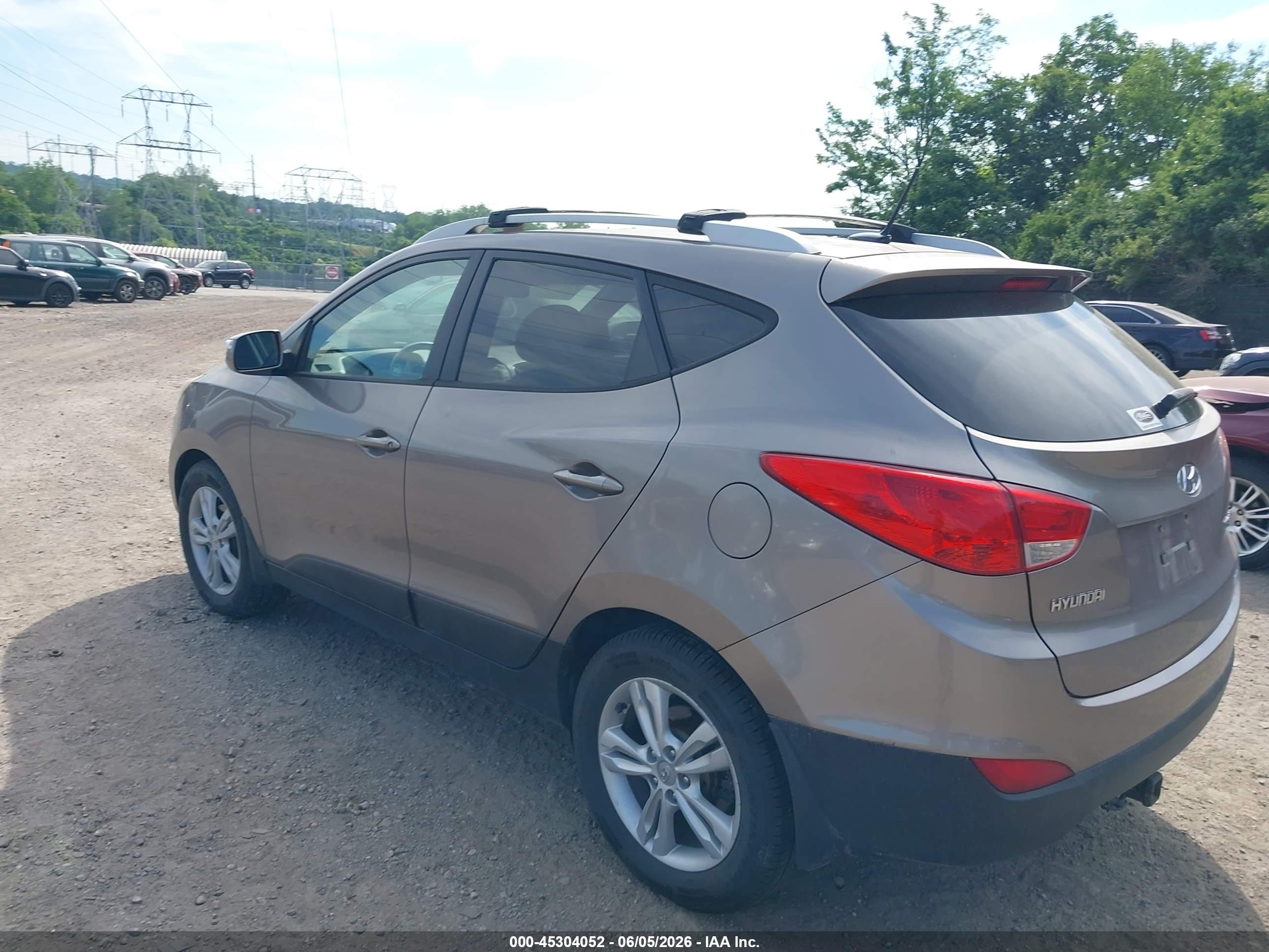 2012 Hyundai Tucson Gls Brown vin: KM8JUCAC3CU404583