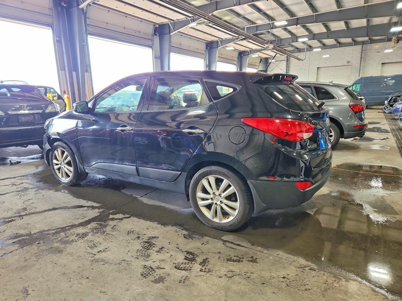 2012 Hyundai Tucson Limited Black vin: KM8JUCAC6CU475907