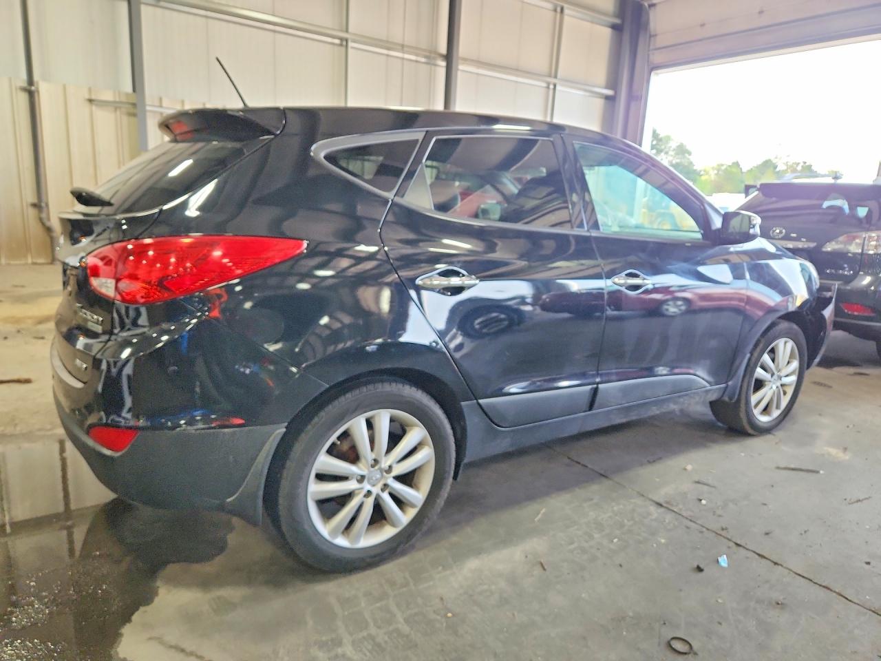 2012 Hyundai Tucson Limited Black vin: KM8JUCAC6CU475907