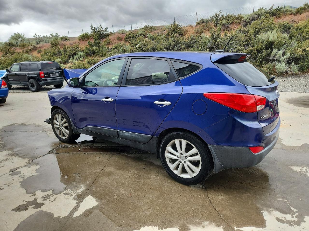 2012 Hyundai Tucson Limited Blue vin: KM8JUCAC7CU424500