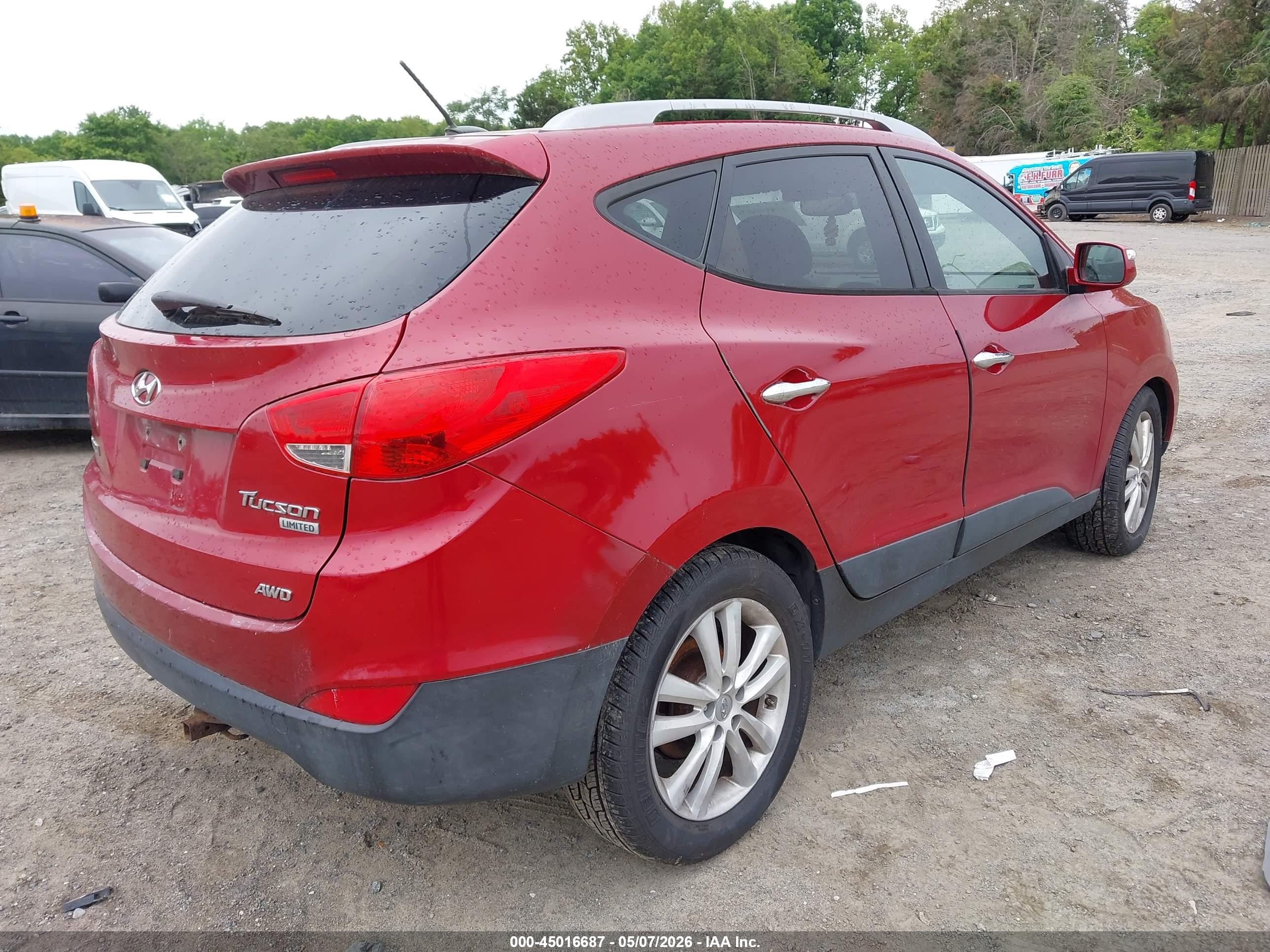 2011 Hyundai Tucson Limited Burgundy vin: KM8JUCACXBU311025
