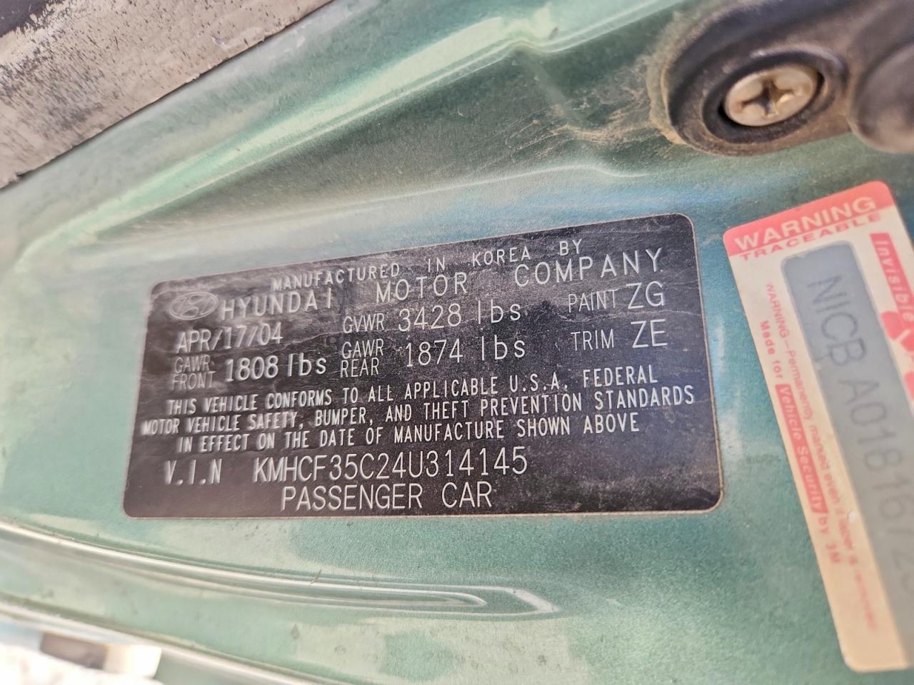 2004 Hyundai Accent L Teal vin: KMHCF35C24U314145