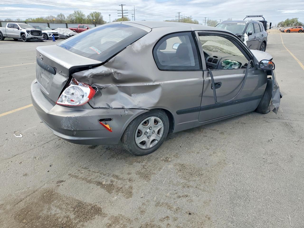 2004 Hyundai Accent Base Gray vin: KMHCF35C54U299849