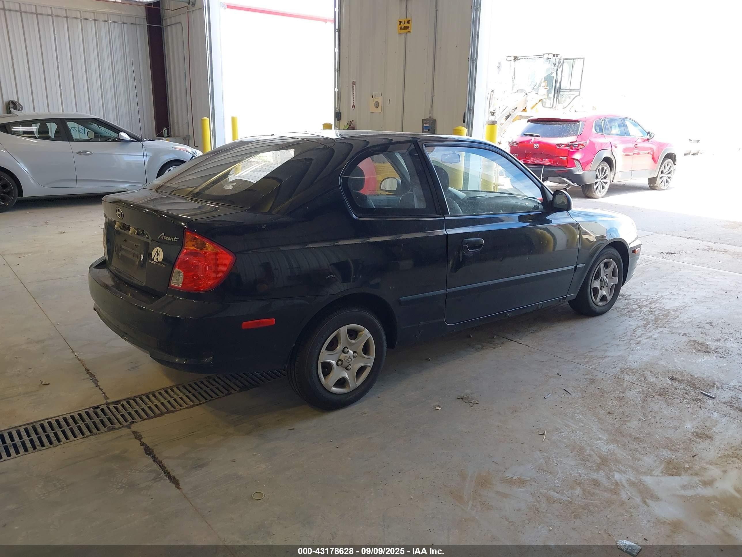 2004 Hyundai Accent   Black vin: KMHCF35C74U310141