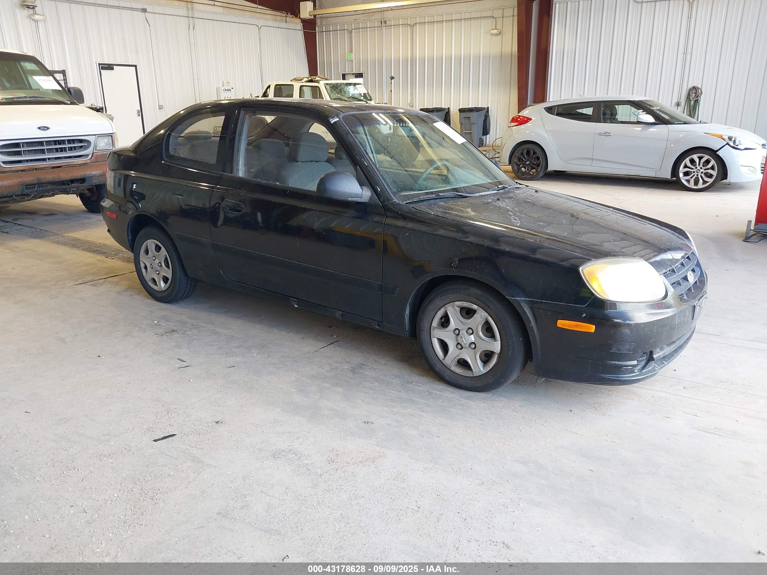 2004 Hyundai Accent   Black vin: KMHCF35C74U310141