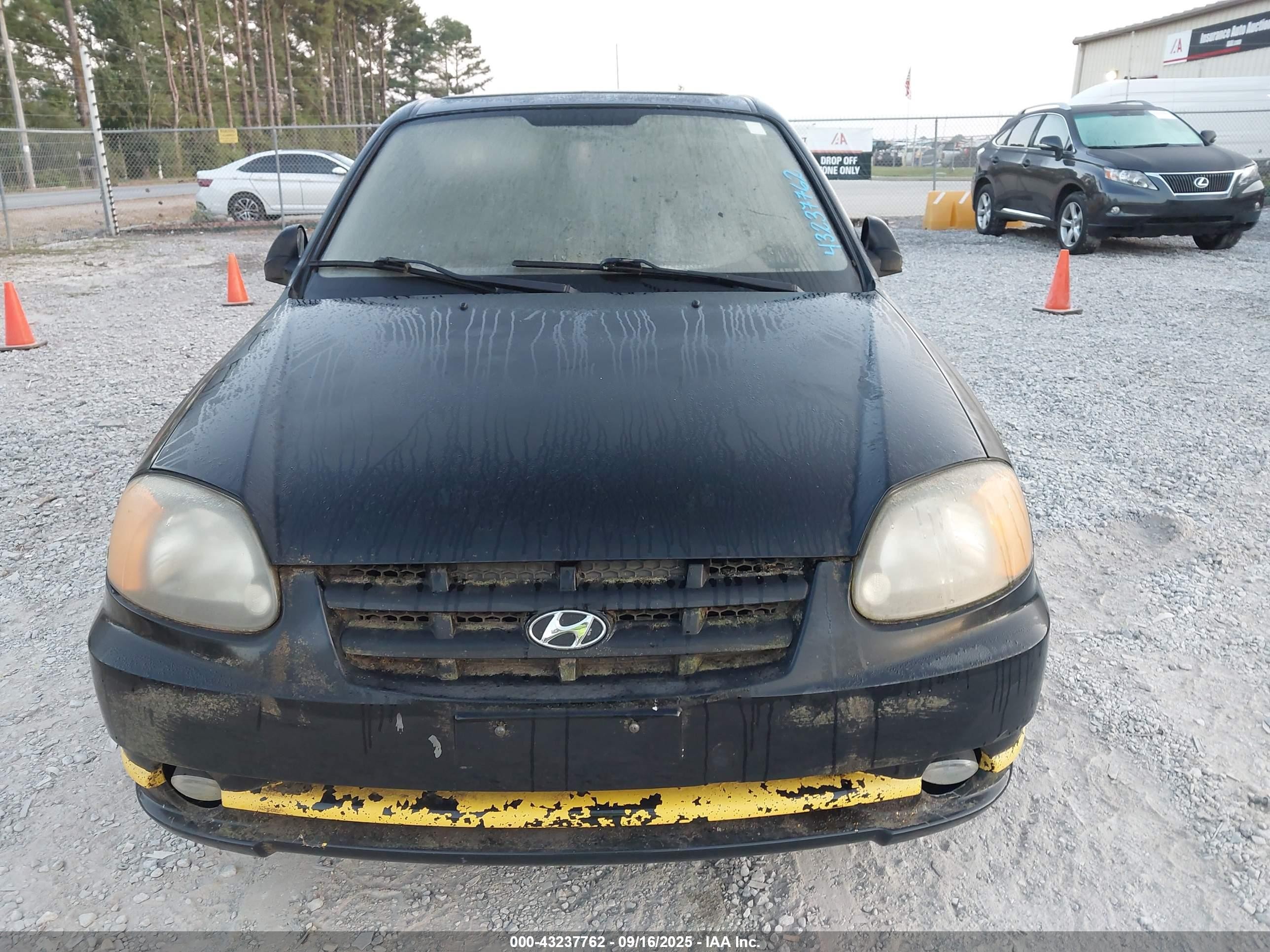 2004 Hyundai Accent   Black vin: KMHCF35C94U289597