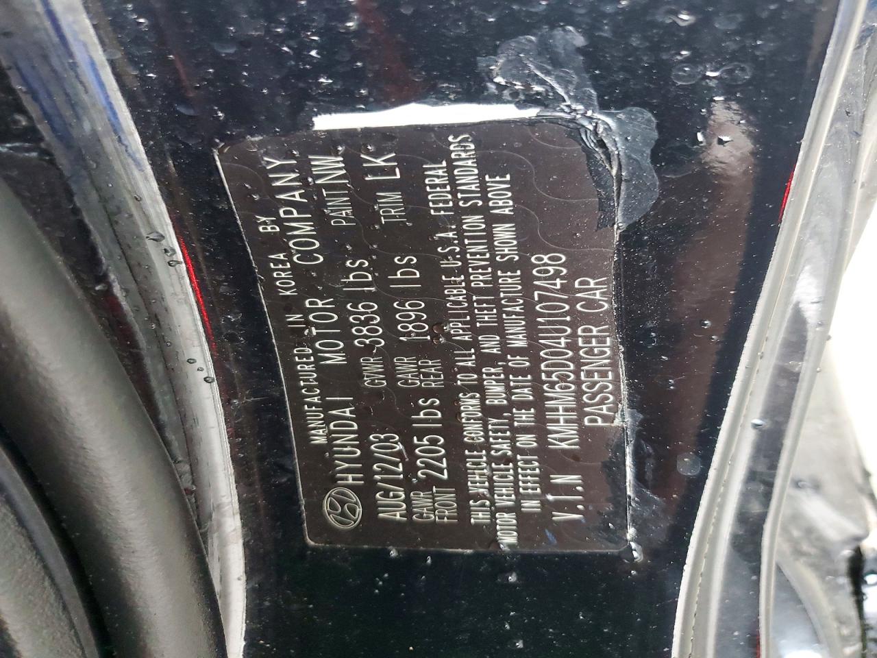 2004 Hyundai Tiburon Base Black vin: KMHHM65D04U107498