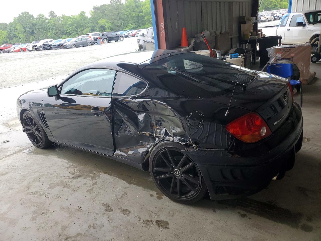2004 Hyundai Tiburon Base Black vin: KMHHM65D04U107498