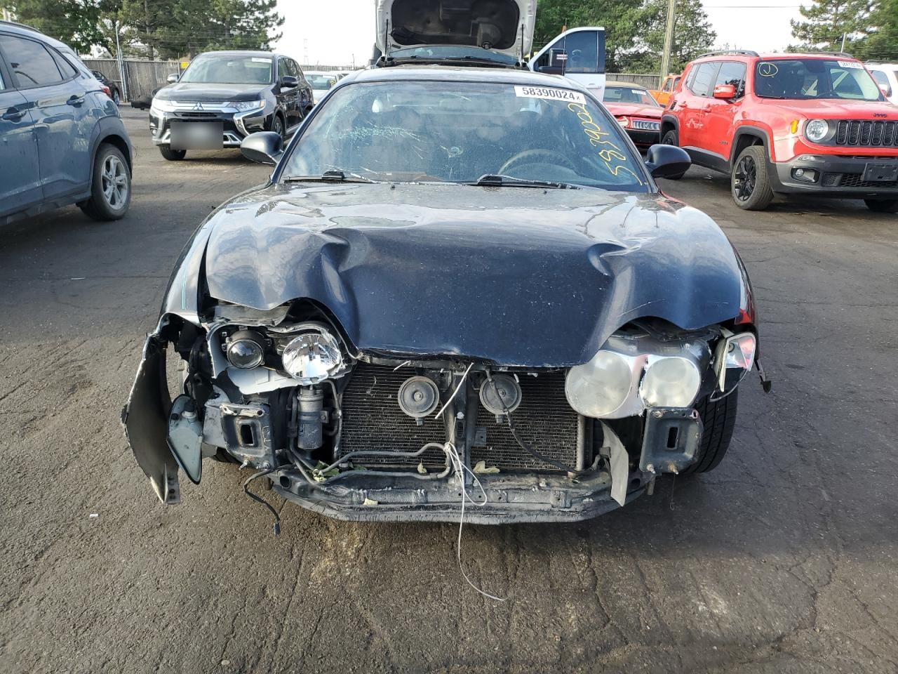 2001 Hyundai Tiburon  Black vin: KMHJG25F21U250094
