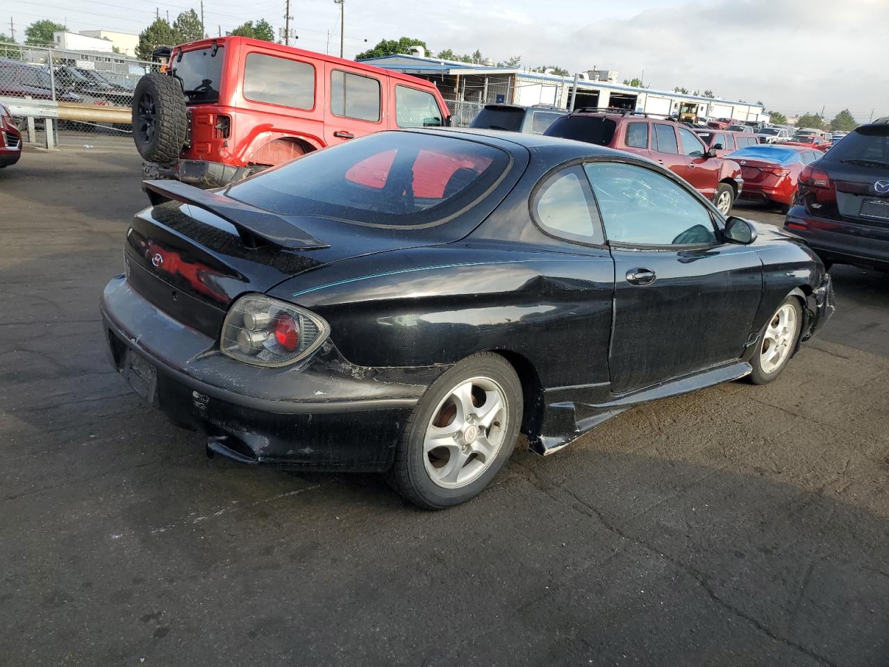 2001 Hyundai Tiburon  Black vin: KMHJG25F21U250094