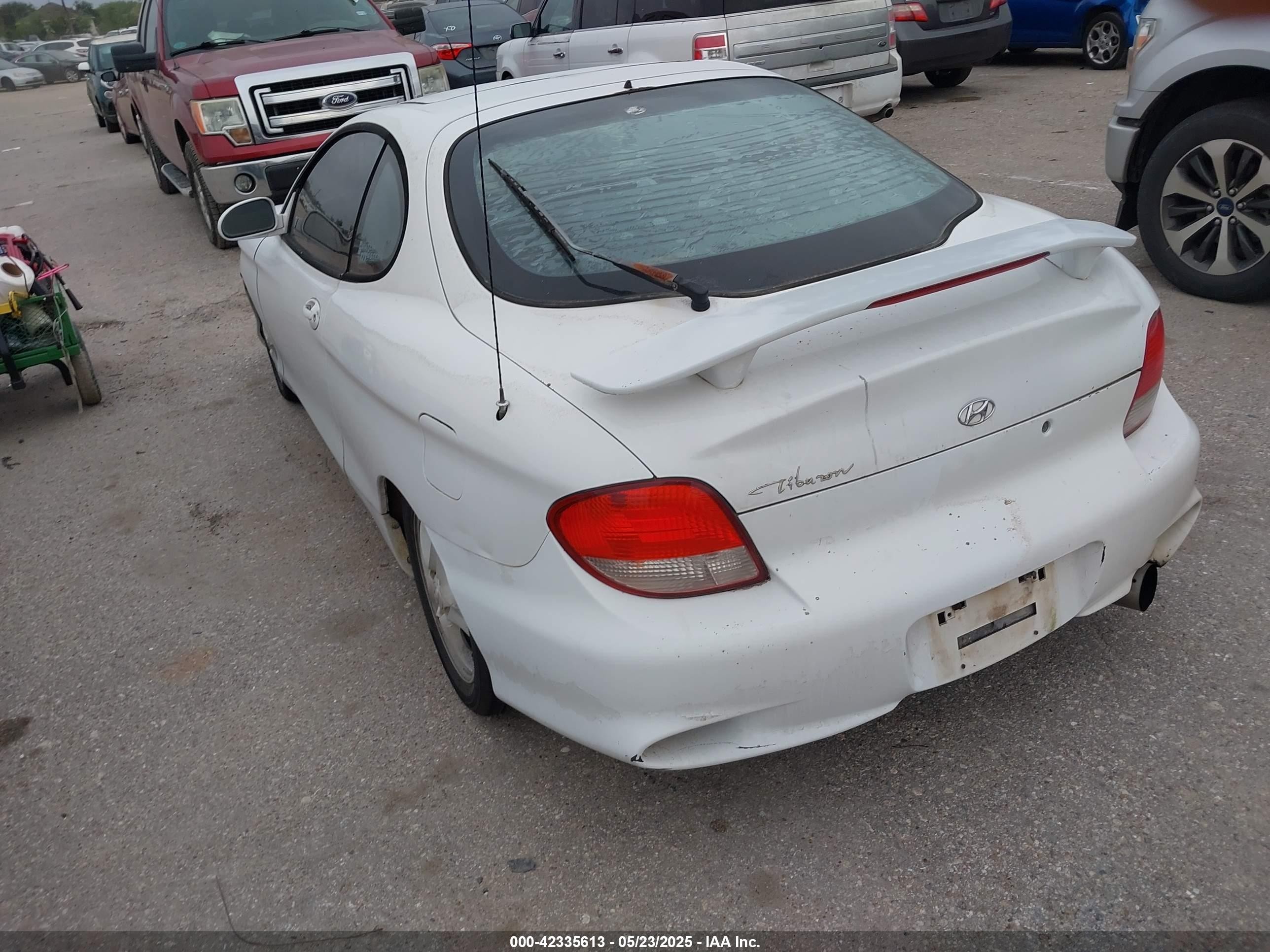 2000 Hyundai Tiburon Base Pkg 1, 2   5/base Pkg 3   4 White vin: KMHJG35F6YU167638