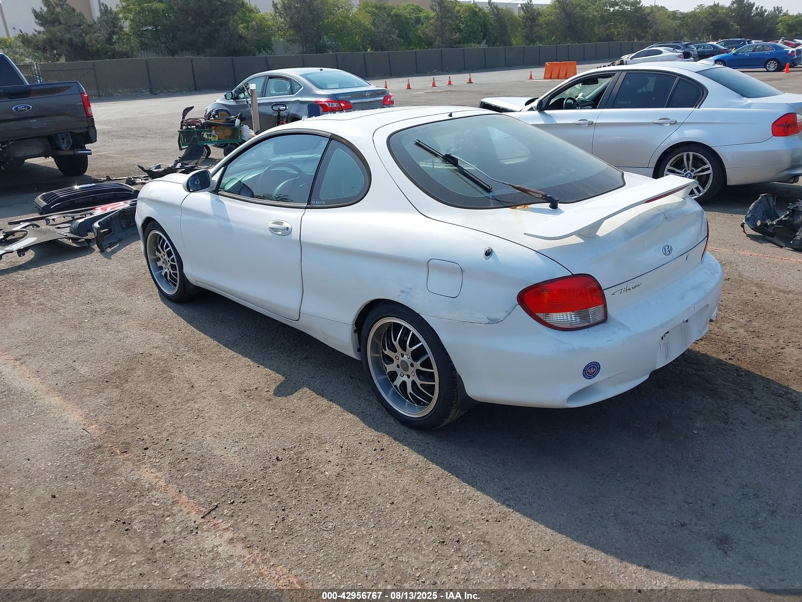 2000 Hyundai Tiburon Base Pkg 1, 2   5/base Pkg 3   4 White vin: KMHJG35F6YU202467