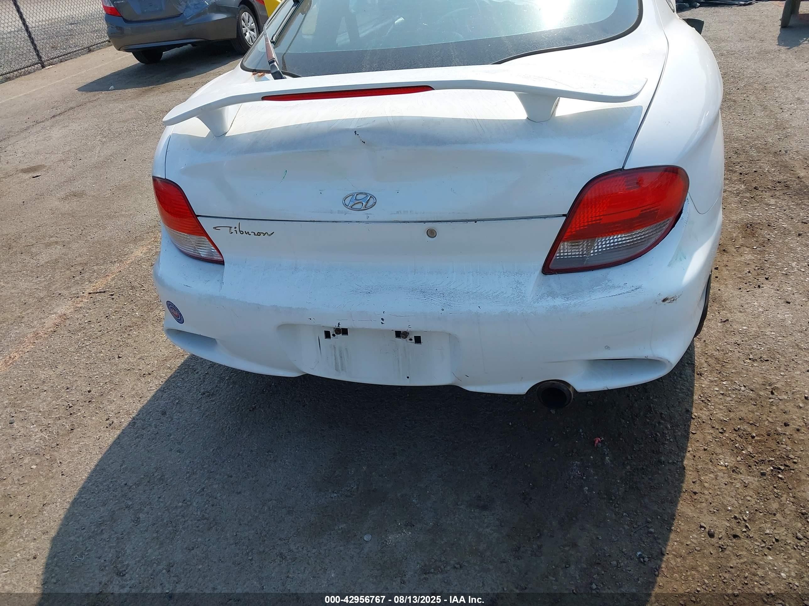 2000 Hyundai Tiburon Base Pkg 1, 2   5/base Pkg 3   4 White vin: KMHJG35F6YU202467