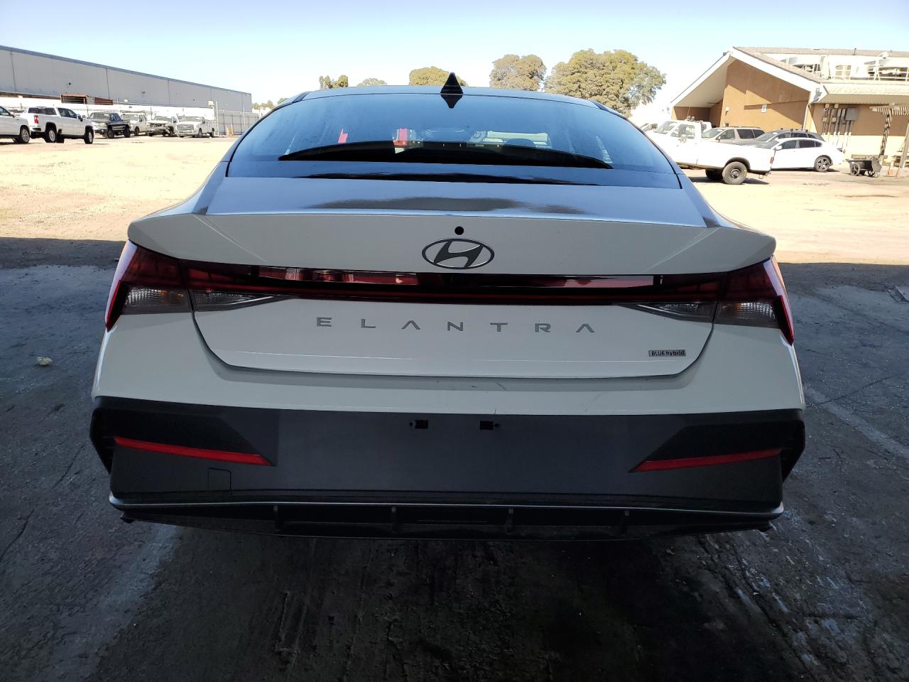 2026 Hyundai Elantra Hybrid Blue White vin: KMHLM4DJXTU205698 Damage: Rear Bumper/Cover, Scraped, 4 To 5 Inches