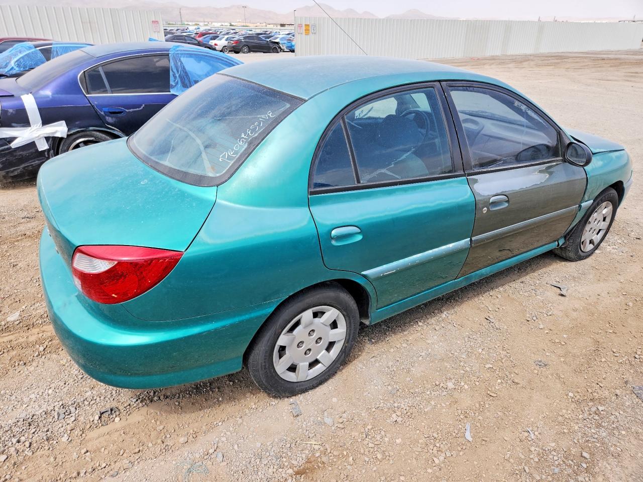 2002 Kia Rio Teal vin: KNADC123626179843
