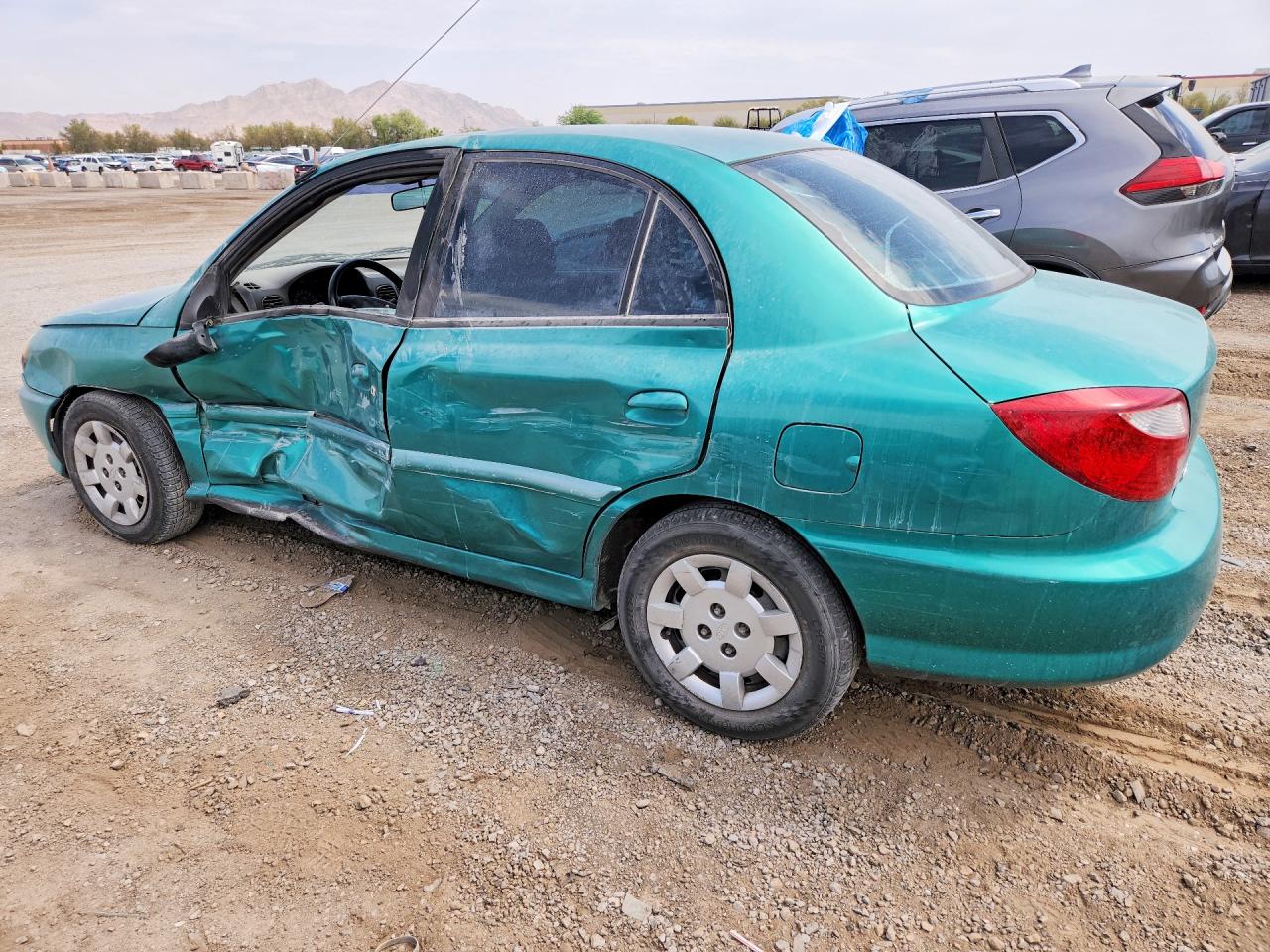 2002 Kia Rio Teal vin: KNADC123626179843