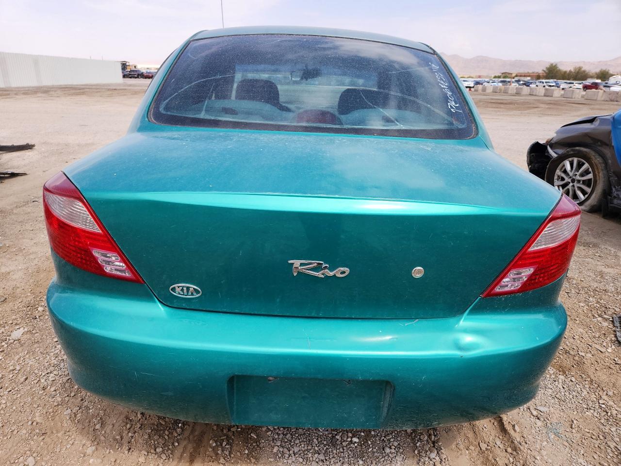2002 Kia Rio Teal vin: KNADC123626179843