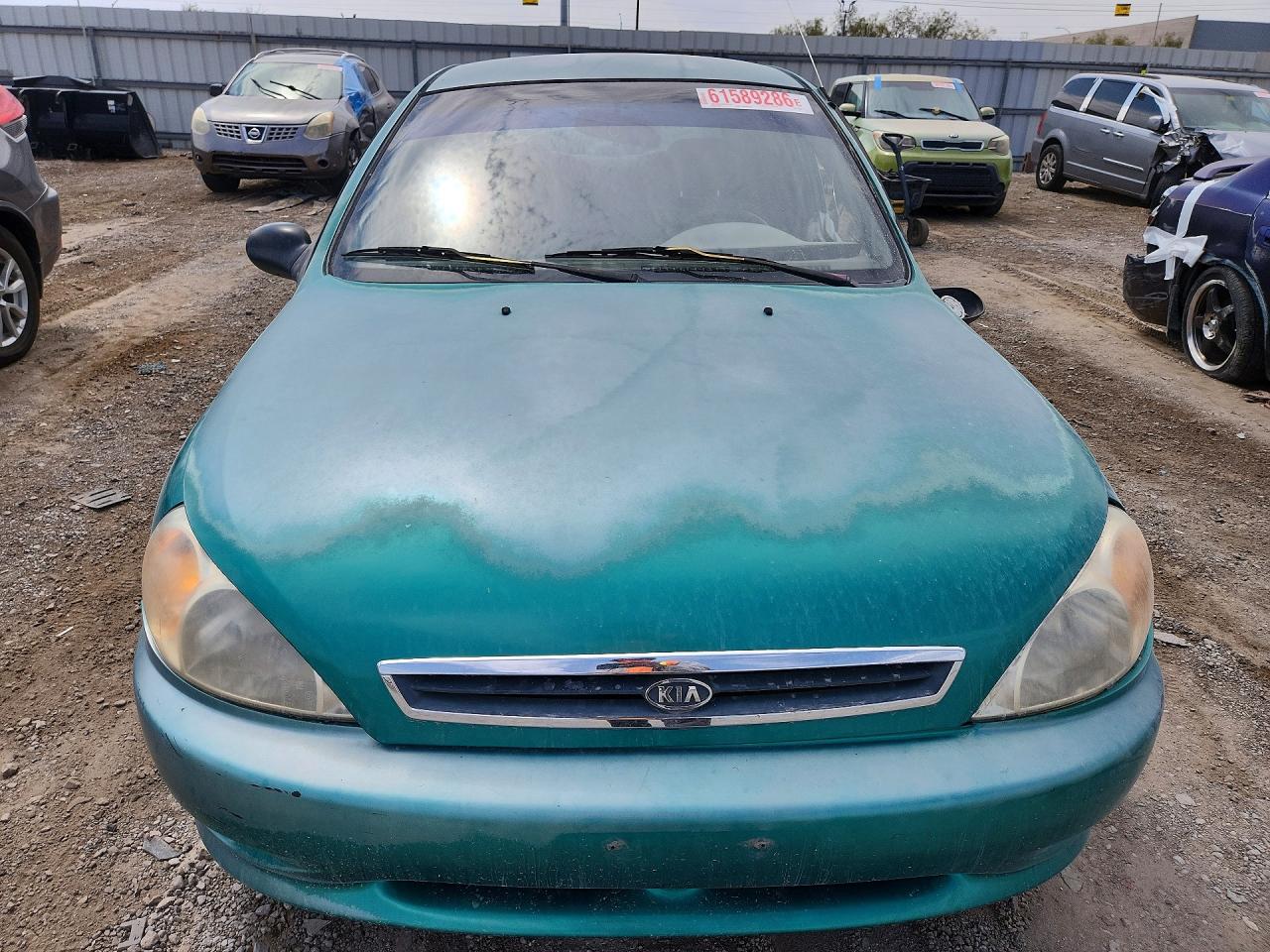 2002 Kia Rio Teal vin: KNADC123626179843