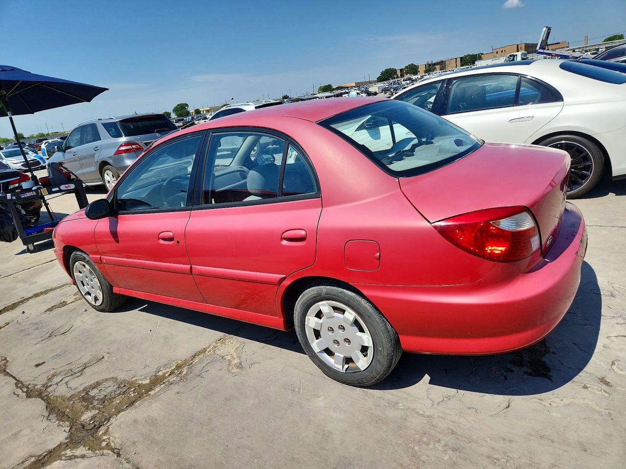2002 Kia Rio Base Red vin: KNADC123926094298