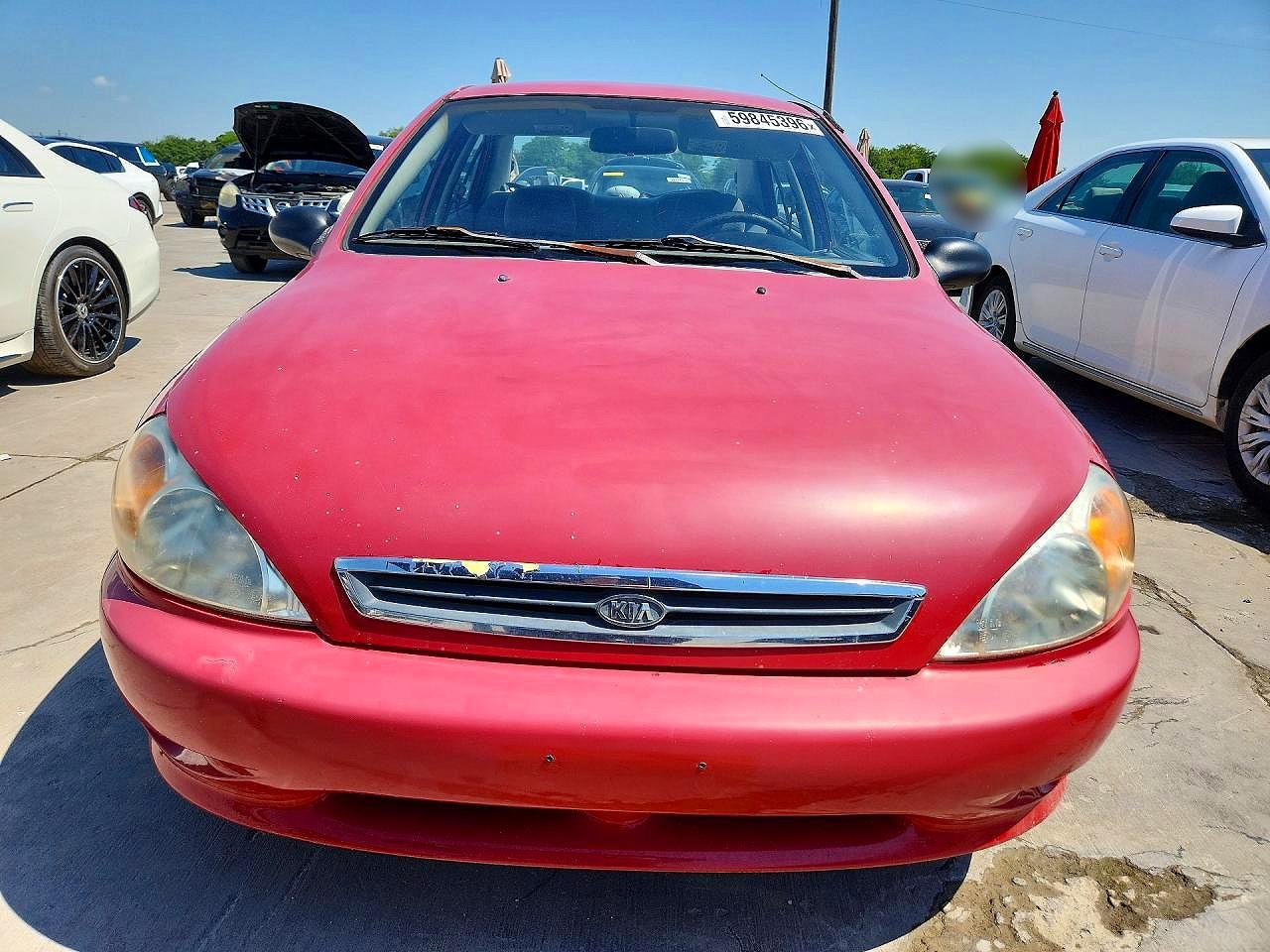 2002 Kia Rio Base Red vin: KNADC123926094298
