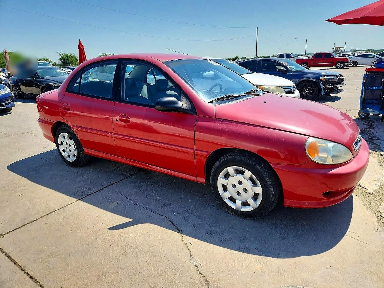 2002 Kia Rio Base Red vin: KNADC123926094298