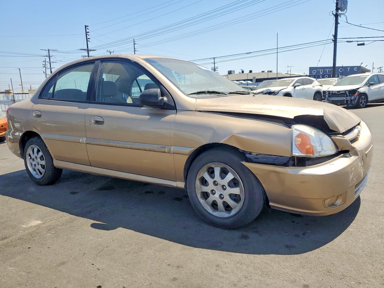 2005 Kia Rio Base Желто-коричневый vin: KNADC125556399027