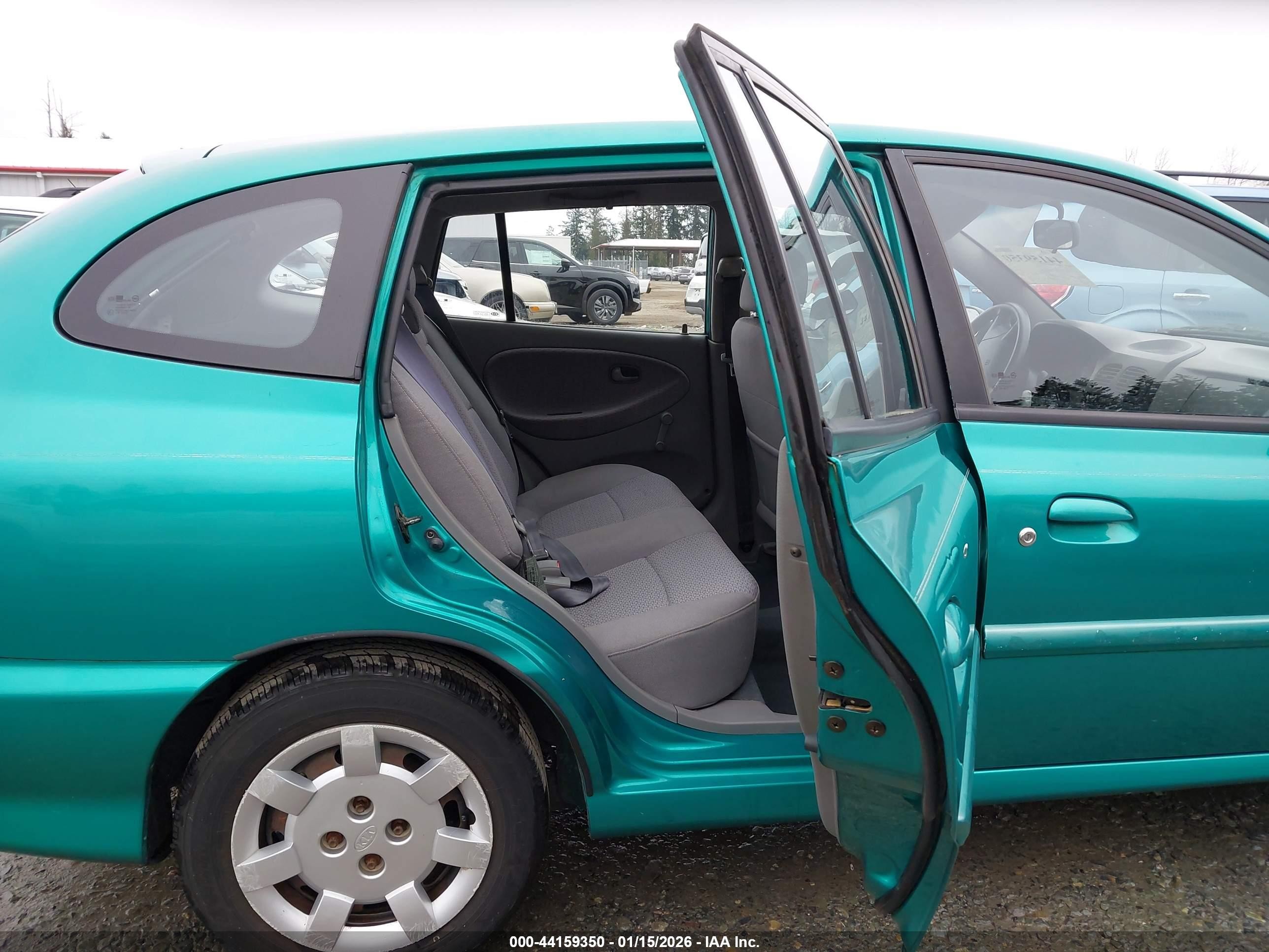 2002 Kia Rio Cinco Teal vin: KNADC163426037100