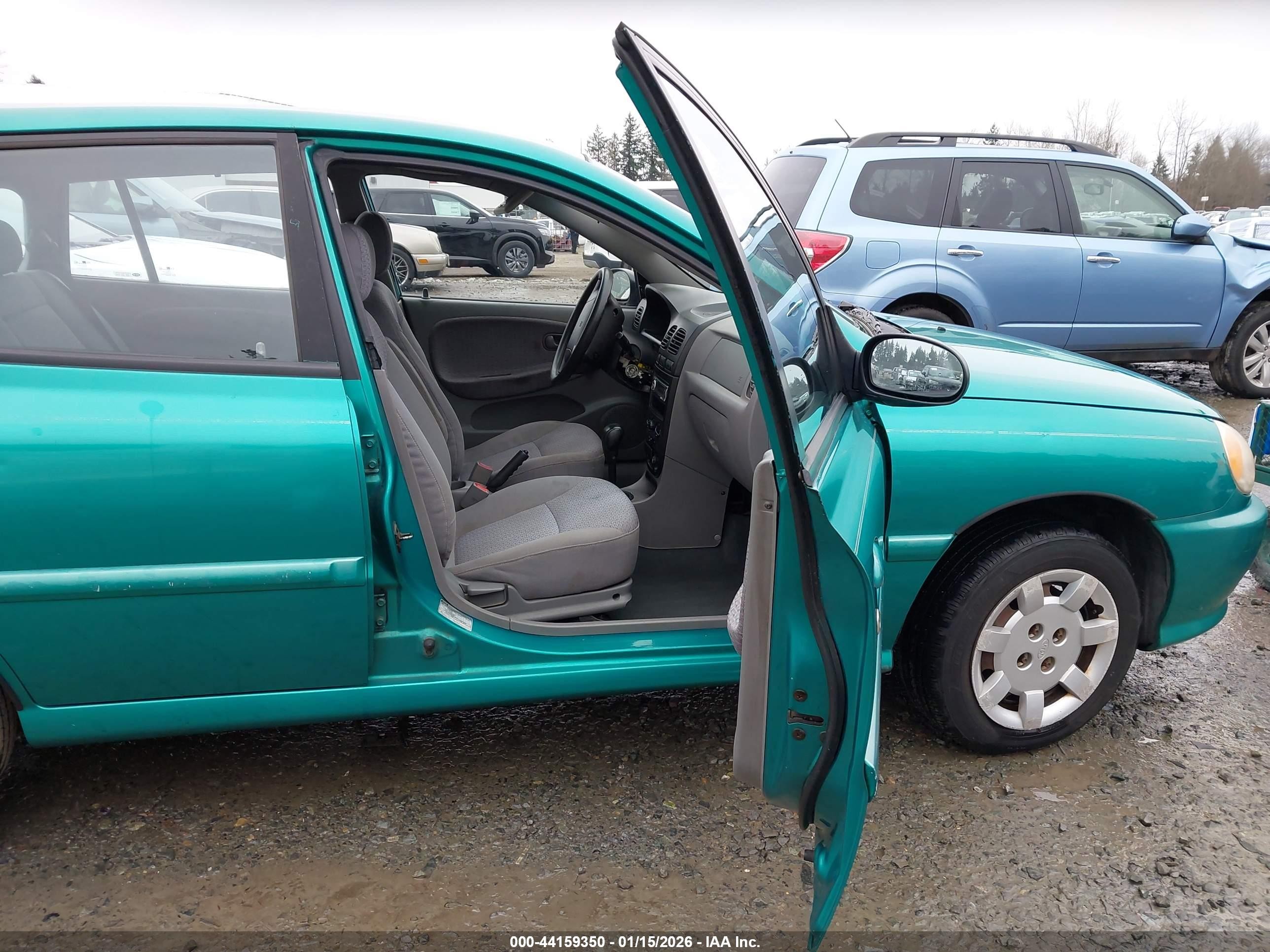 2002 Kia Rio Cinco Teal vin: KNADC163426037100