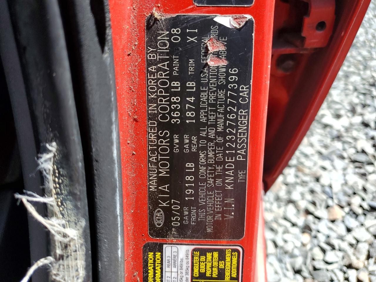 2007 Kia Rio Base Red vin: KNADE123276277396