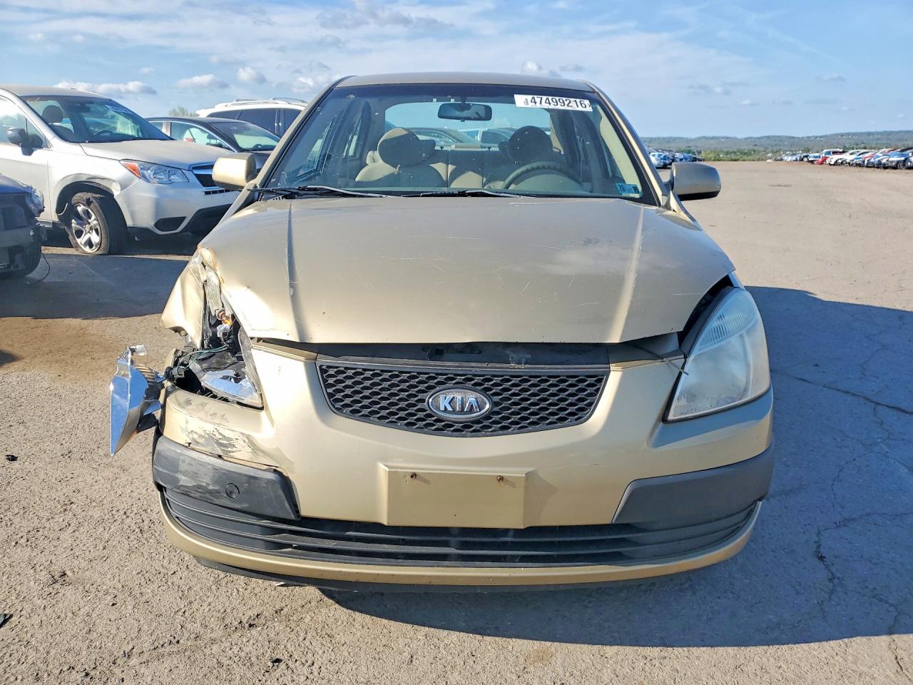 2008 Kia Rio Base Tan vin: KNADE123286397488