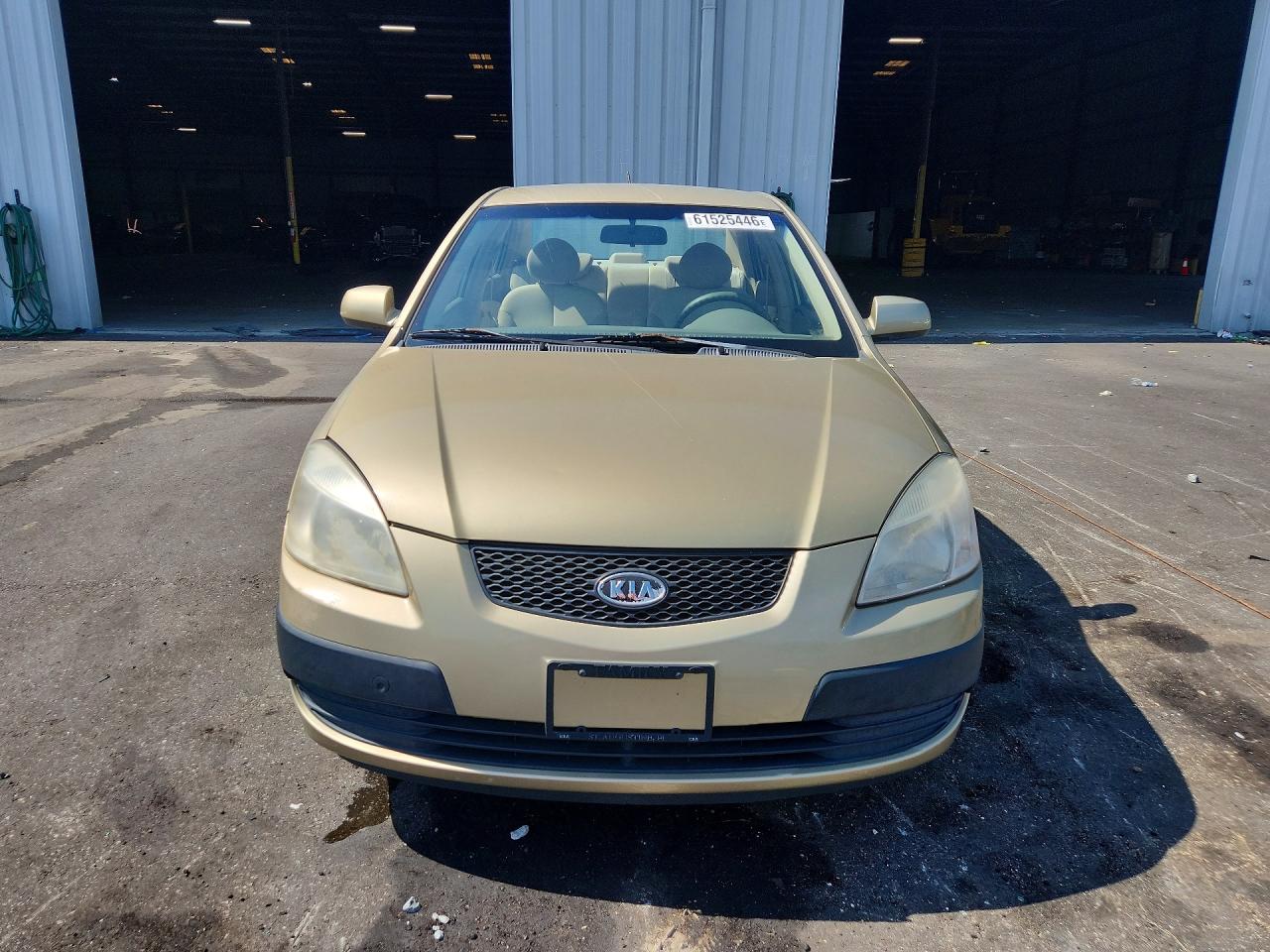 2006 Kia Rio Base Gold vin: KNADE123366064195
