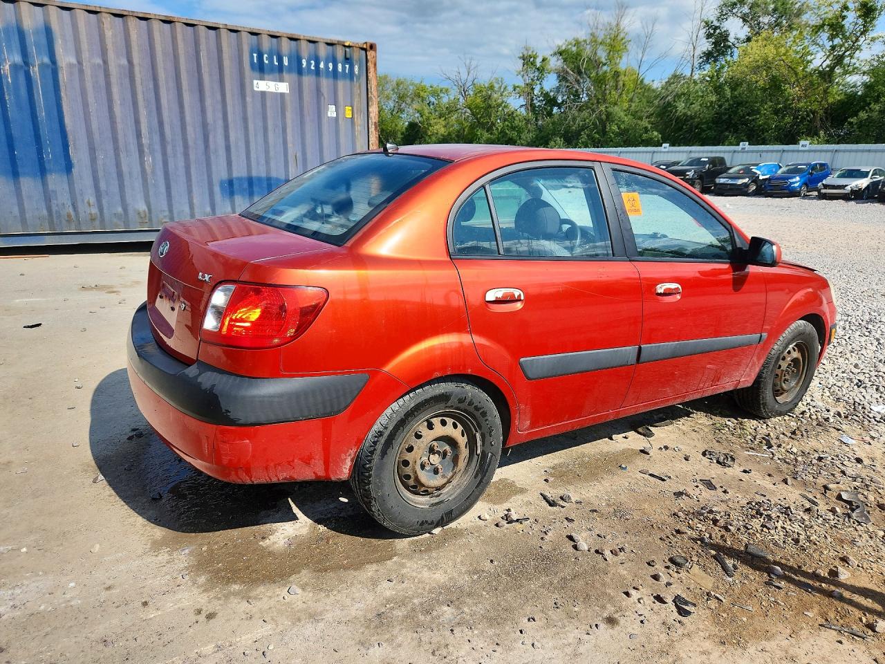 2007 Kia Rio Base Orange vin: KNADE123876187248
