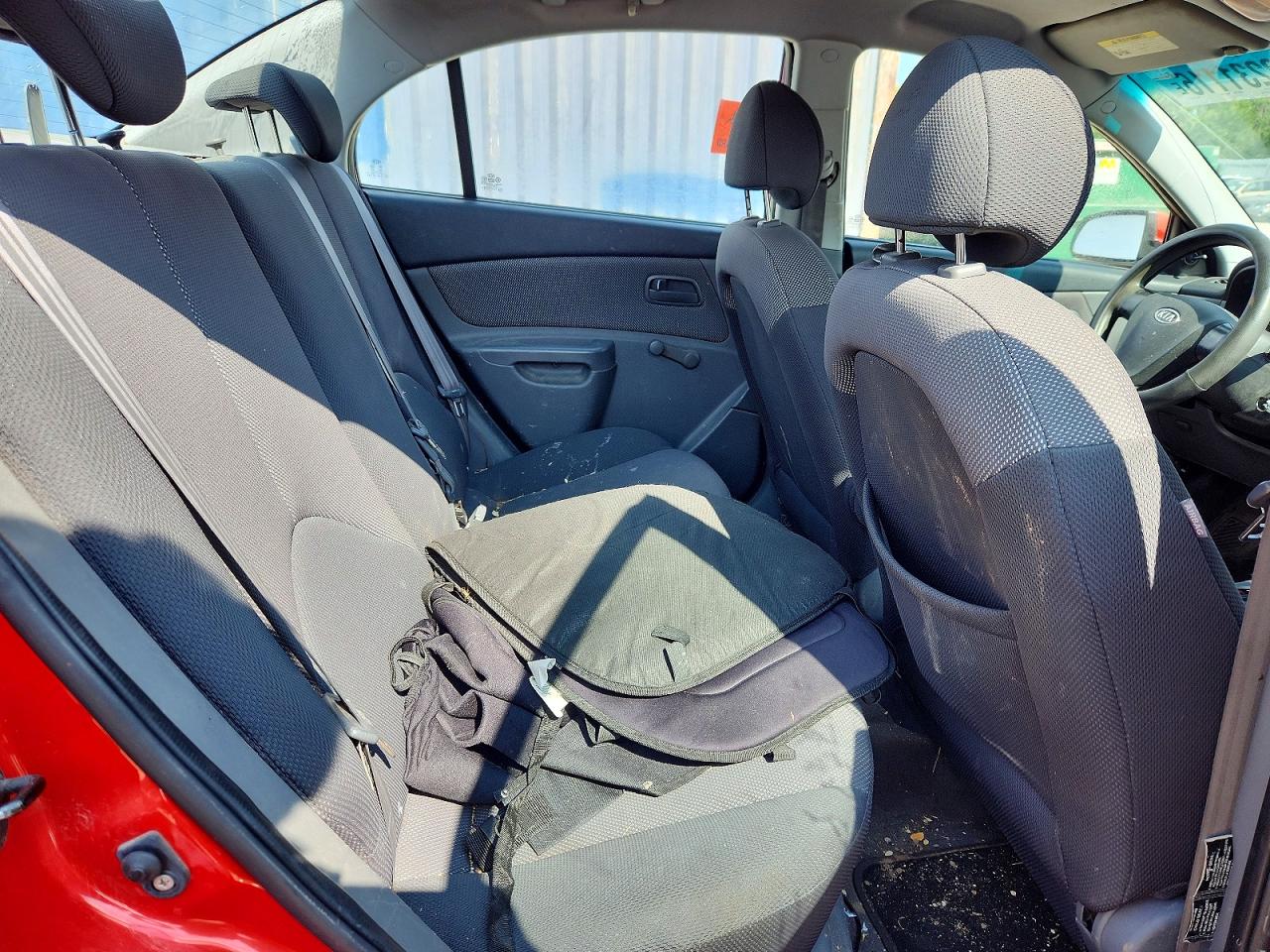 2007 Kia Rio Base Orange vin: KNADE123876187248