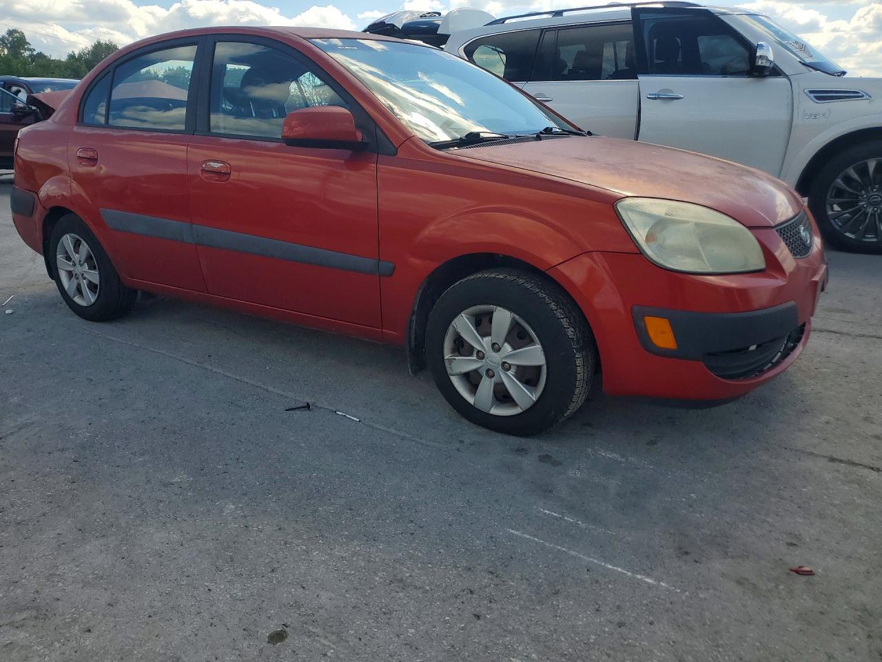 2008 Kia Rio Base Orange vin: KNADE123986322383