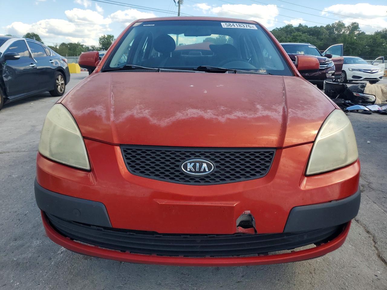 2008 Kia Rio Base Orange vin: KNADE123986322383