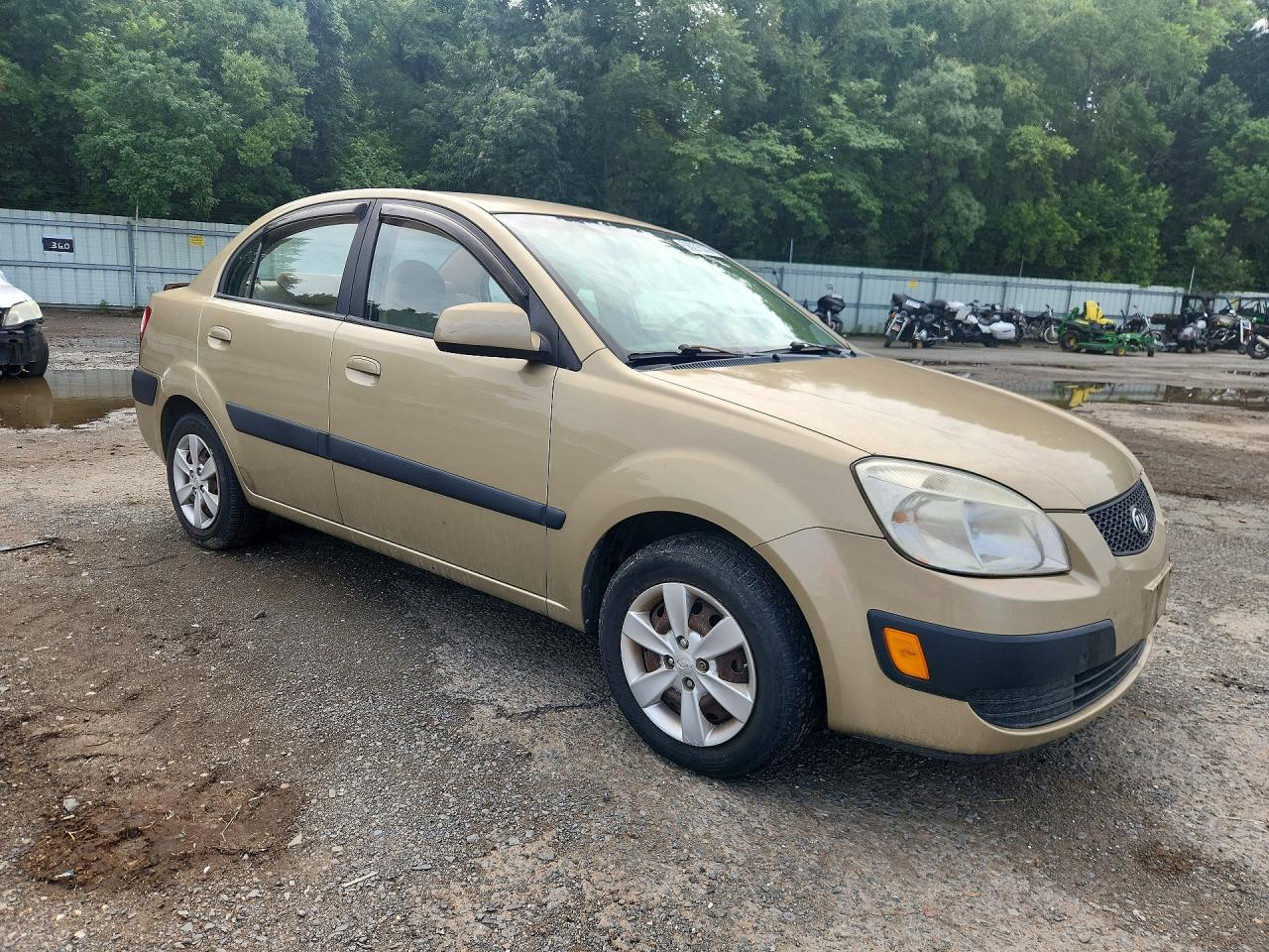 2009 Kia Rio Base Tan vin: KNADE223296538602