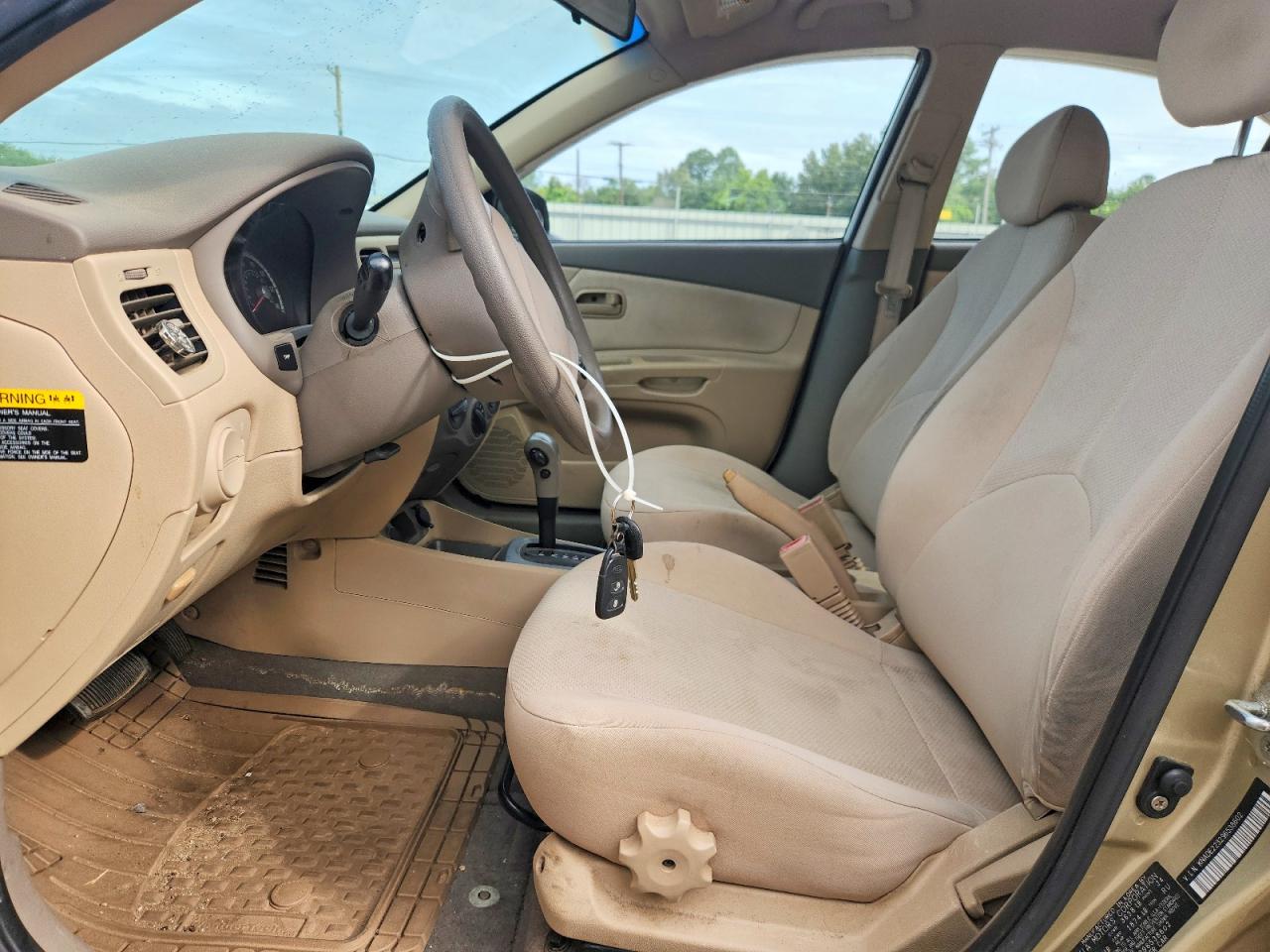 2009 Kia Rio Base Tan vin: KNADE223296538602