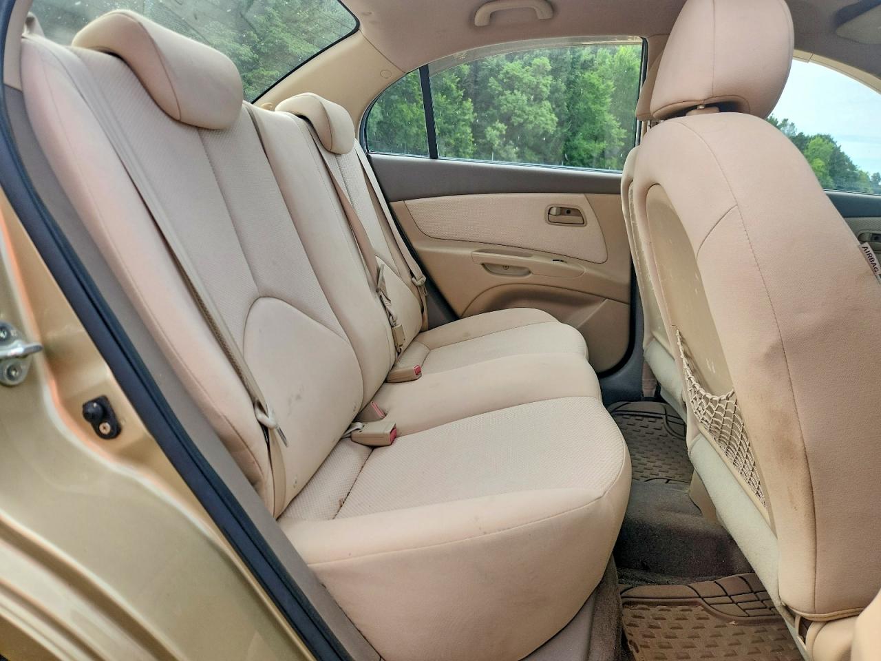 2009 Kia Rio Base Tan vin: KNADE223296538602