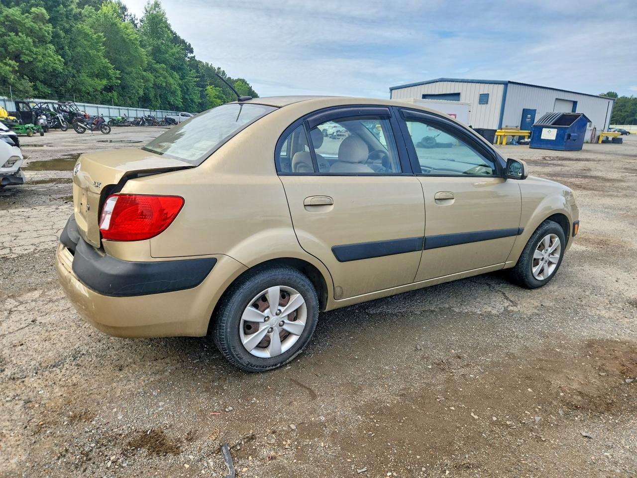 2009 Kia Rio Base Tan vin: KNADE223296538602