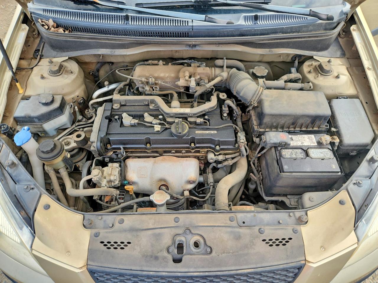 2009 Kia Rio Base Tan vin: KNADE223296538602