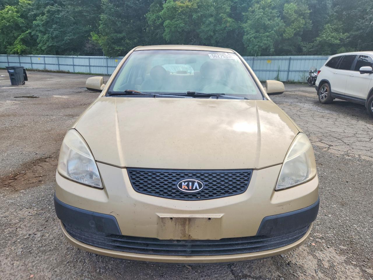 2009 Kia Rio Base Tan vin: KNADE223296538602