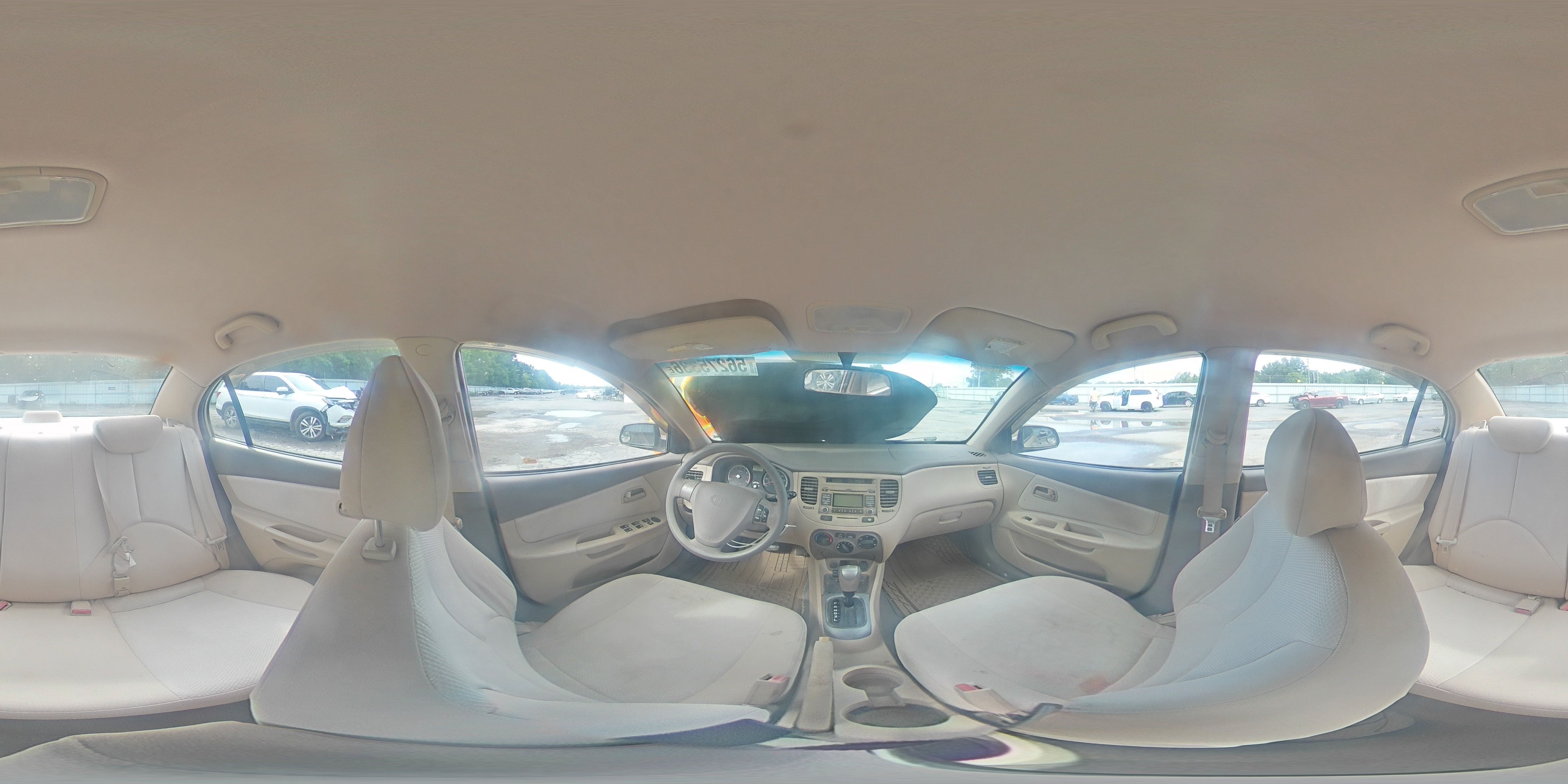 2009 Kia Rio Base Tan vin: KNADE223296538602